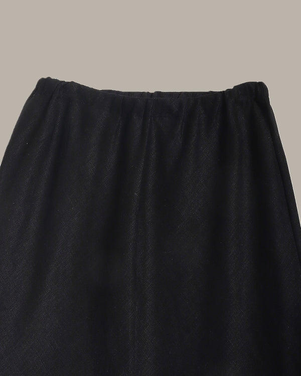 close up of a Black skirt on a neutral background