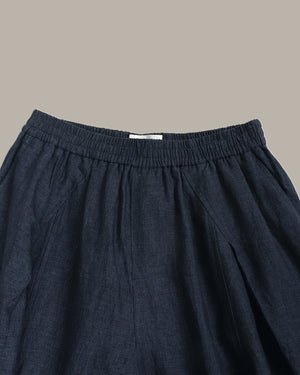 navy wide-leg pants on a light gray background