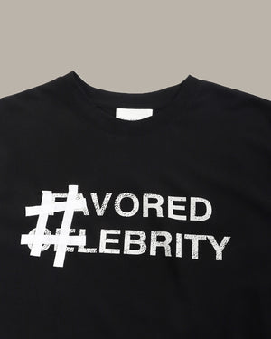 Black sweatshirt with '#favored #celebrity' text on a gray background