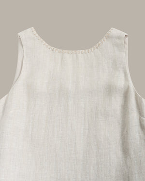 Light beige sleeveless top on a neutral background