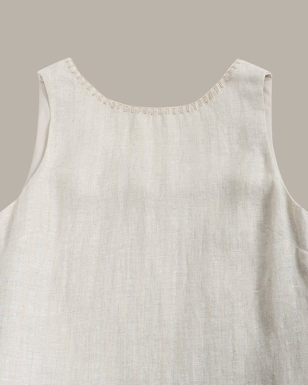 Light beige sleeveless top on a neutral background