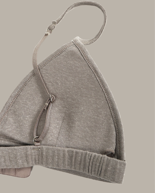 Gray bra on a beige background
