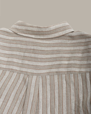 Close-up of the back of the striped shirt  on a beige background