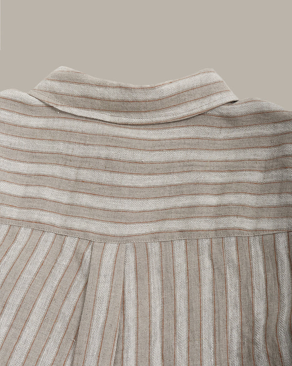 Close-up of the back of the striped shirt  on a beige background