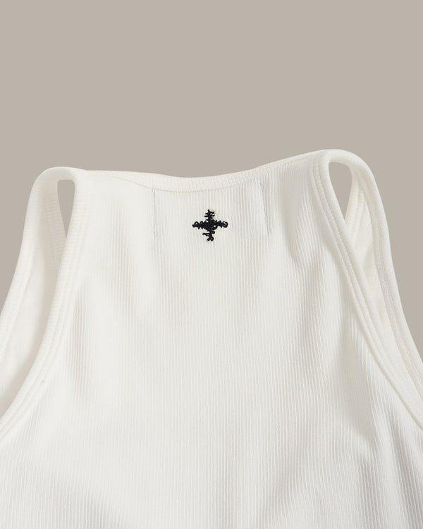 White tank top with a black logo on a beige background
