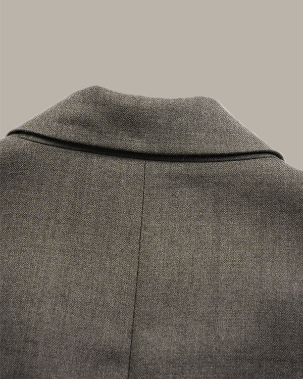Close-up of a gray textured wool coat showing the collar and back seam against a solid neutral background.