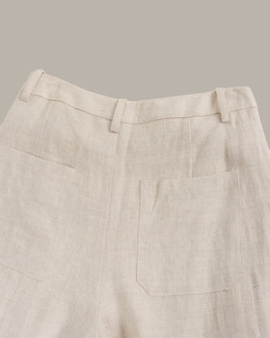 Beige pants with a pocket on a gray background