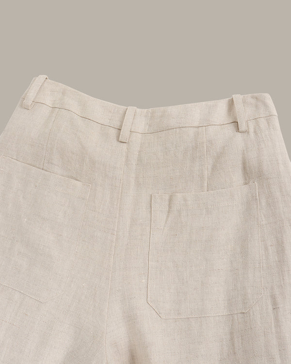 Beige pants with a pocket on a gray background