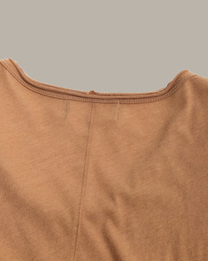 Close-up of a brown garment with a plain background