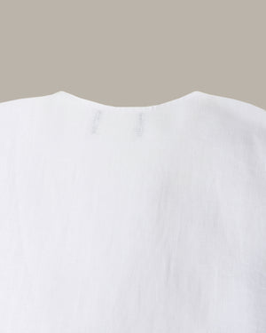 Close-up of a white garment with a neutral background