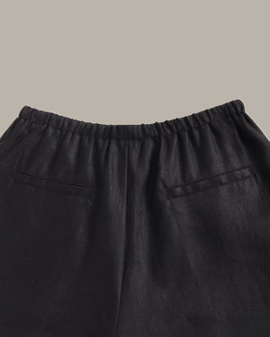 Black pants with a plain background