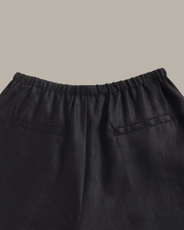 Black pants with a plain background