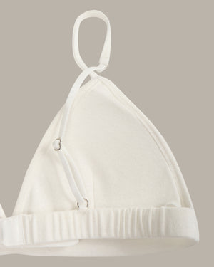 White bra on a beige background