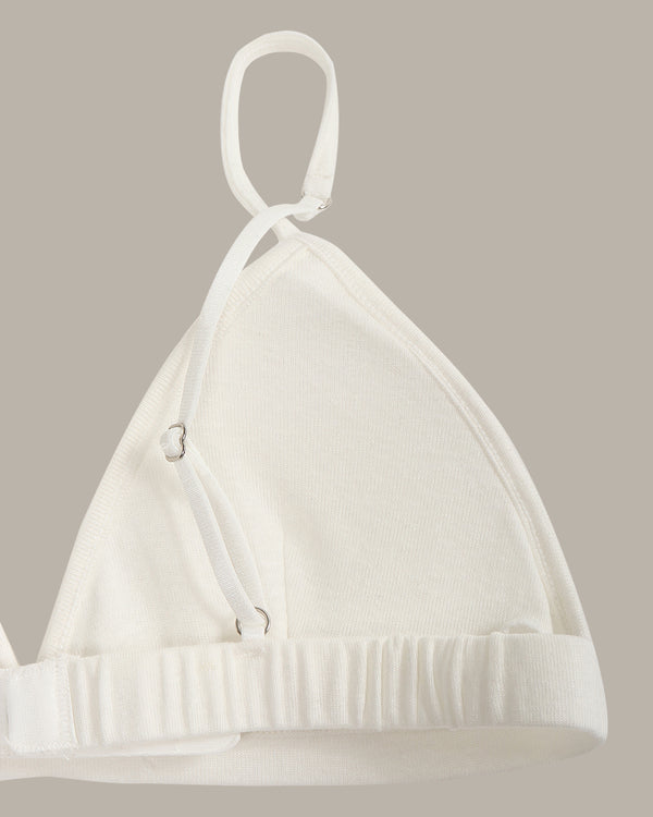 White bra on a beige background