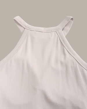 Light gray ribbed tank top on a beige background