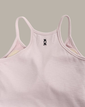 Pink ribbed tank top with thin straps on a gray background