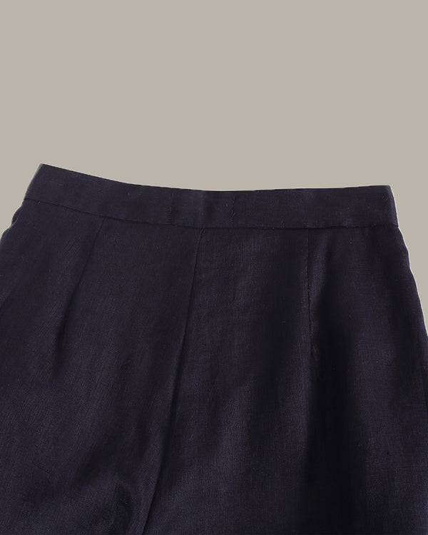 Dark blue pants on a beige background