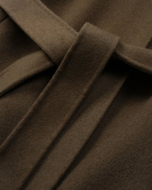 Close-up of a brown wool or cashmere fabric with a matching tie belt, showing the soft texture and folds.