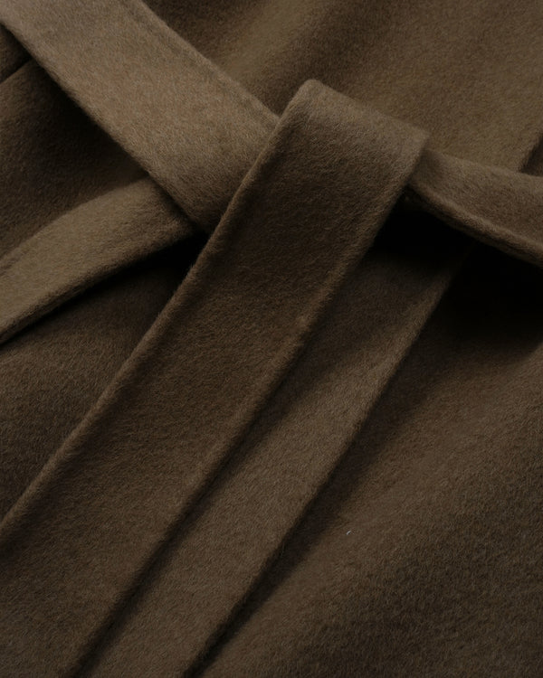 Close-up of a brown wool or cashmere fabric with a matching tie belt, showing the soft texture and folds.
