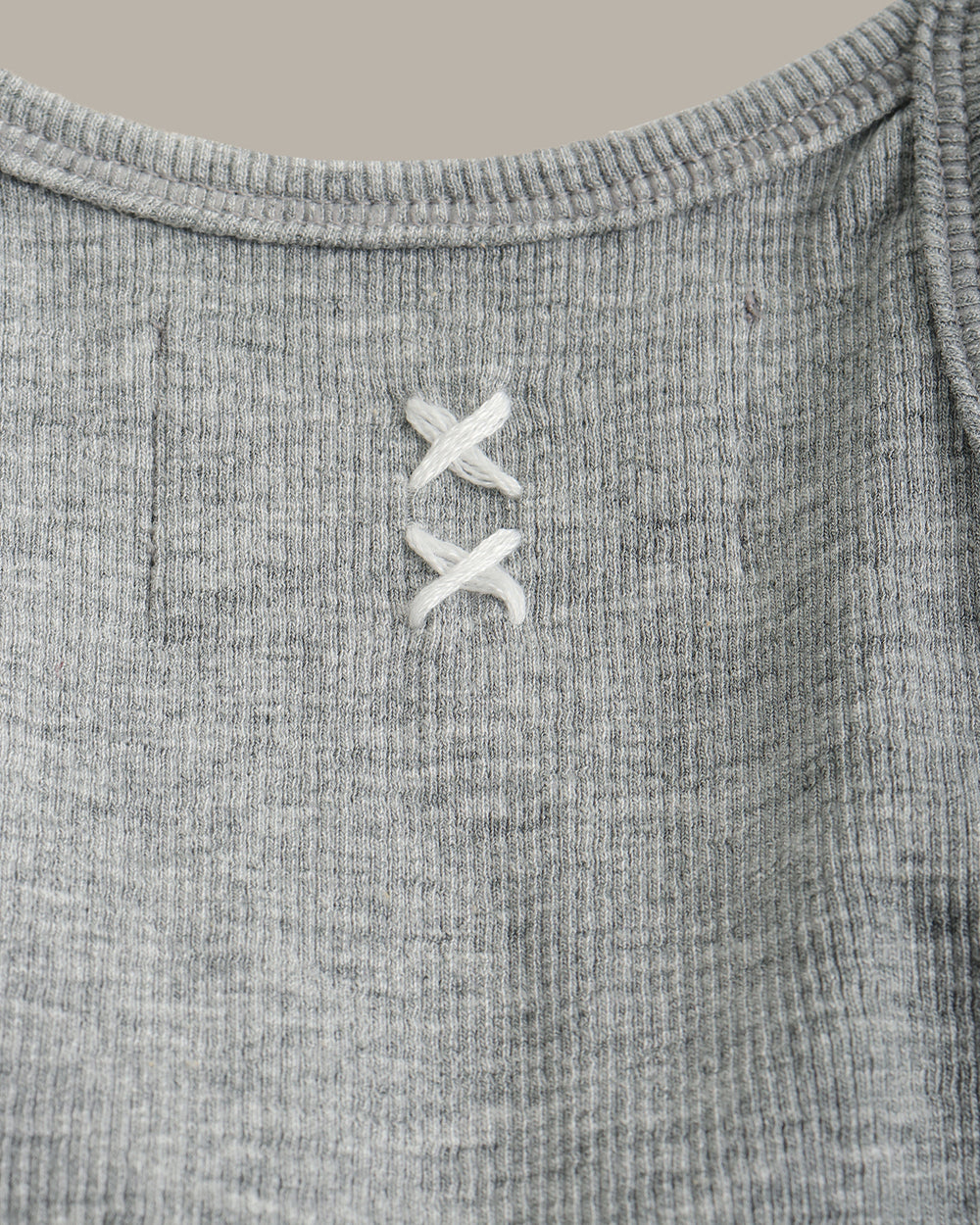 Gray tank top on a beige background