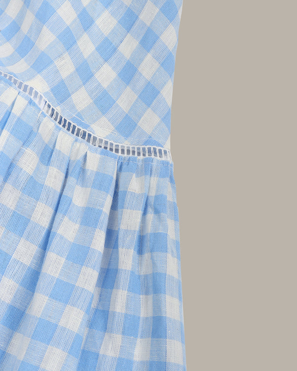 Blue and white checkered dress on a gray background