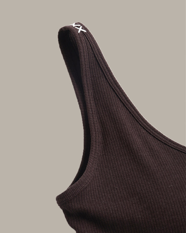 Brown ribbed tank top with a brand logo on a beige background