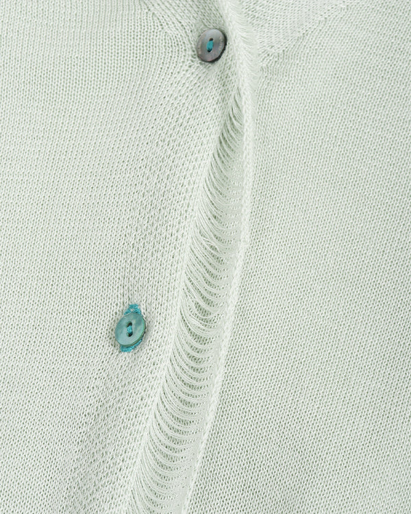 Close-up of a light gray shirt with button details