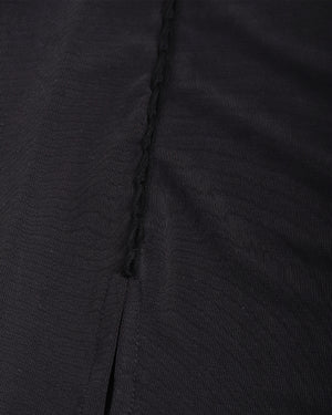 Close-up of black fabric with a visible seam