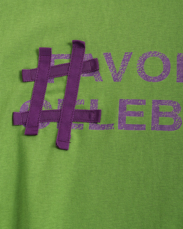 Green shirt with purple text and hashtag design