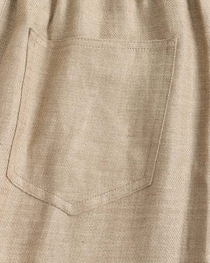 Close-up of a beige shirt with a pocket