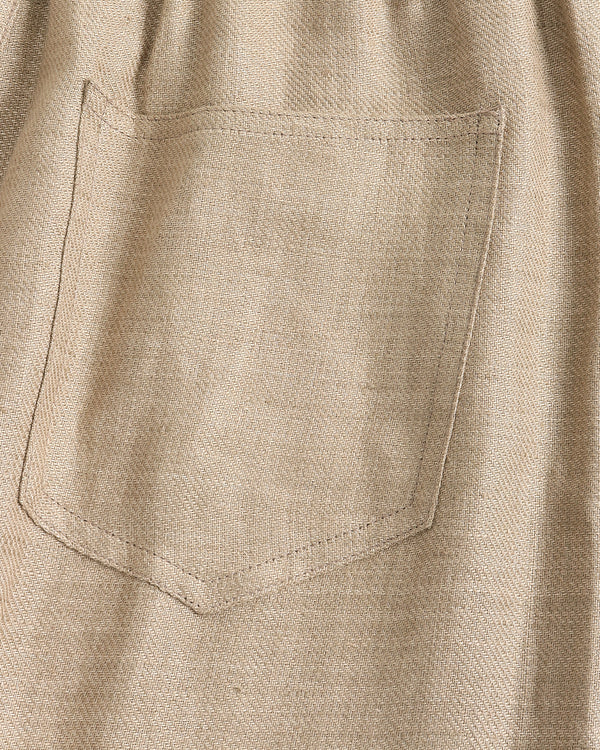 Close-up of a beige shirt with a pocket