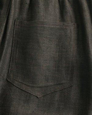 Close-up of a dark gray fabric with a pocket