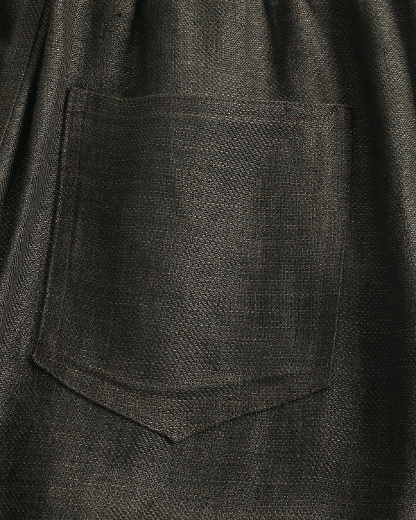Close-up of a dark gray fabric with a pocket