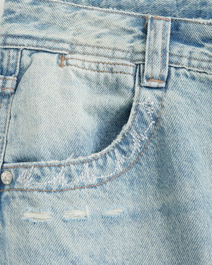 Close-up of a blue denim pocket with stitching details