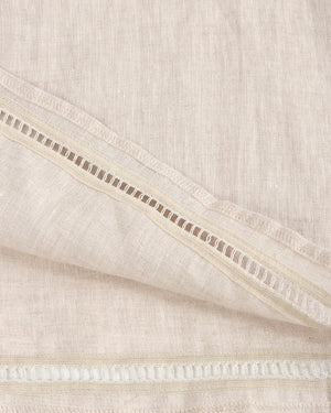 Close-up of beige fabric with a subtle pattern