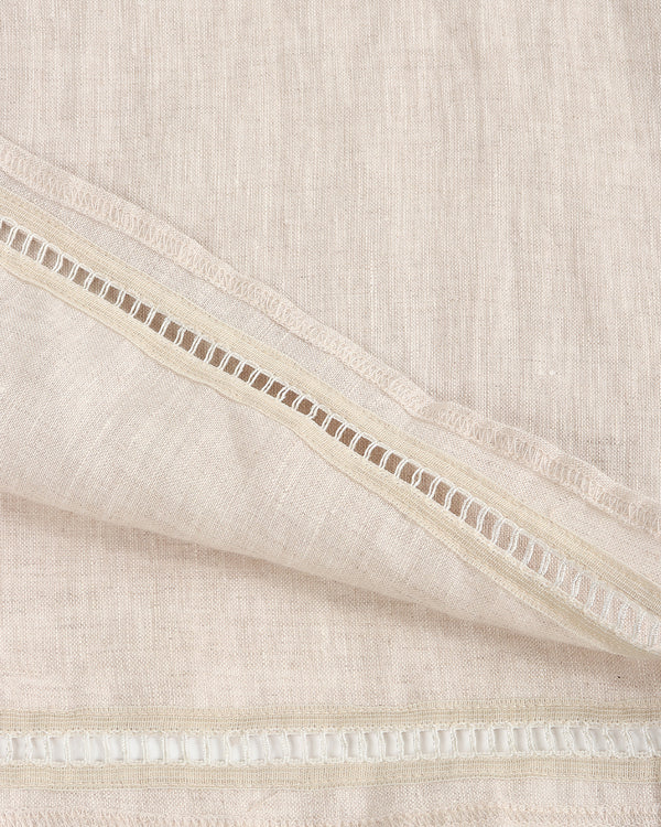 Close-up of beige fabric with a subtle pattern
