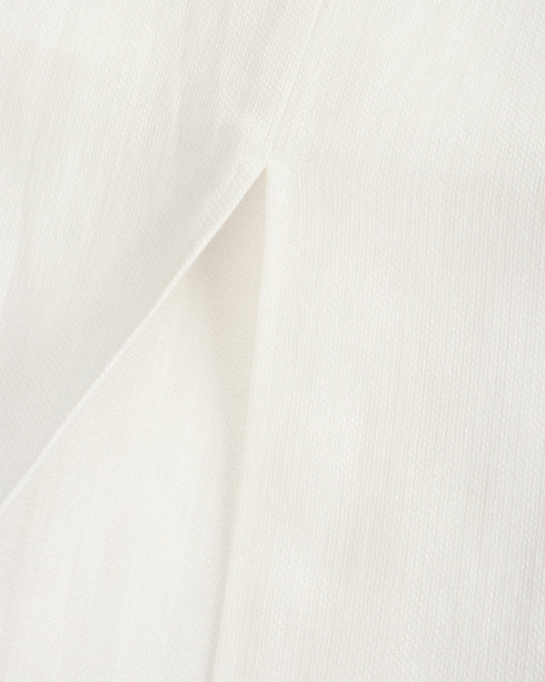 Close-up of white fabric with a subtle pattern