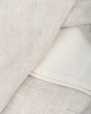 Close-up of beige fabric with a white band