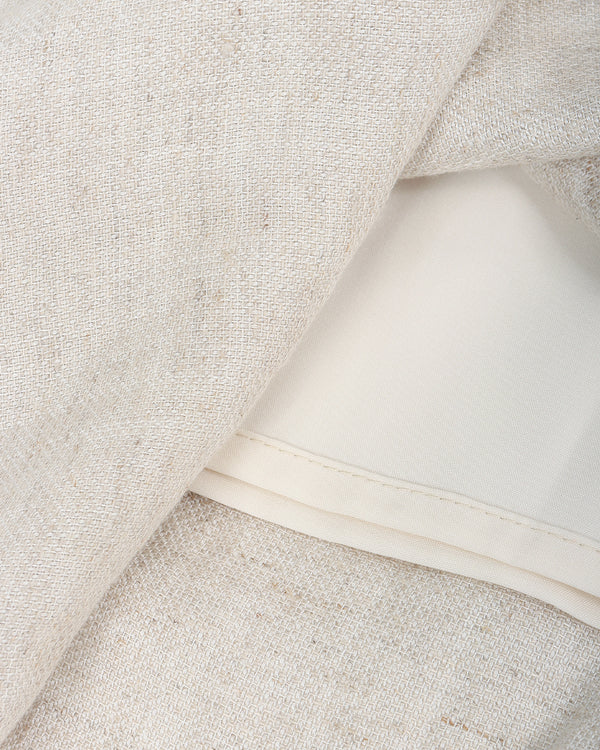 Close-up of beige fabric with a white band