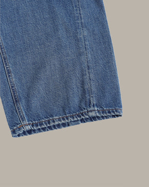 Close-up of blue denim fabric on a gray background